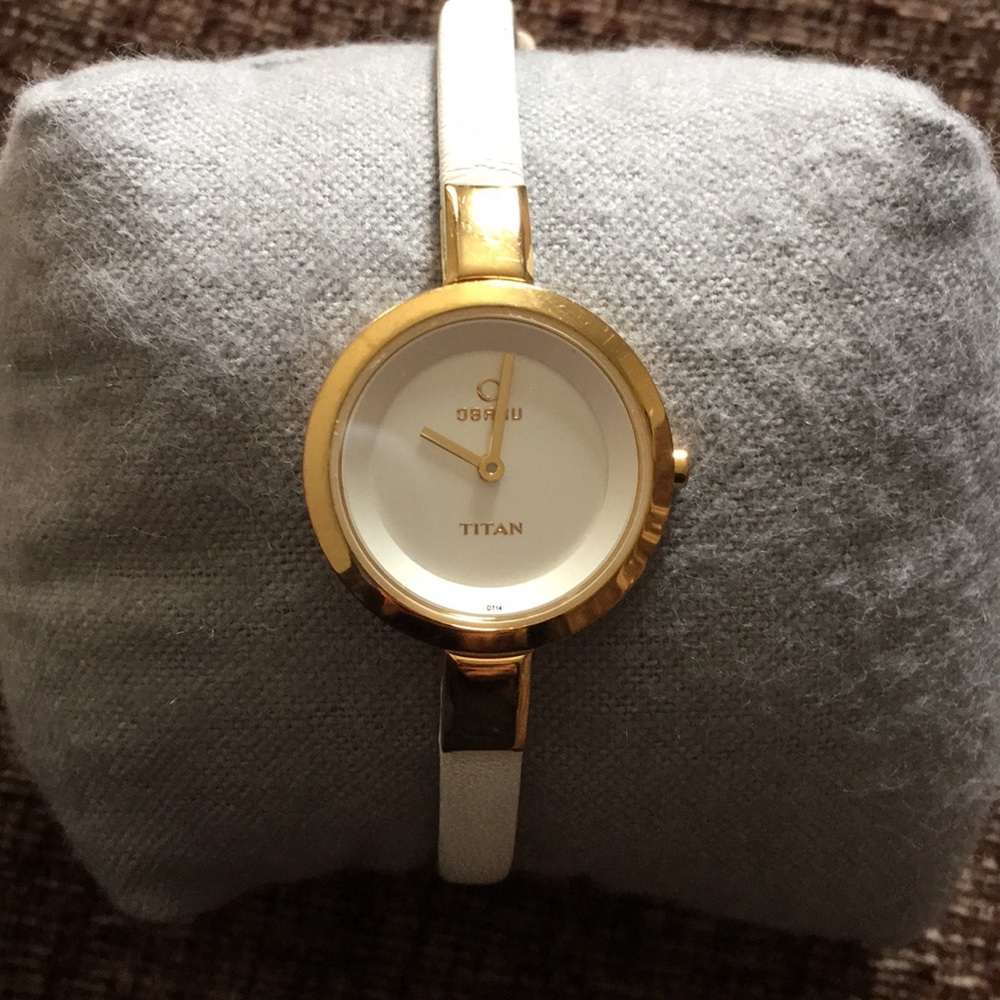 Delicate white and gold watch